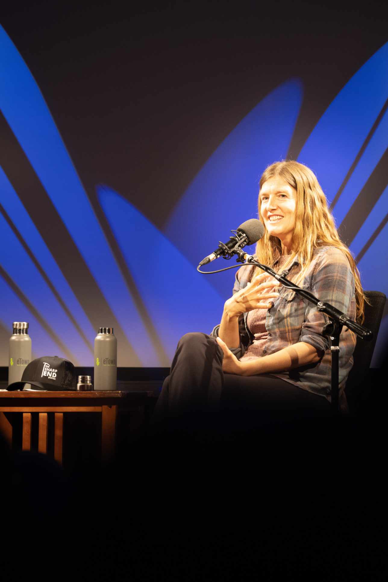 Laura speaking onstage at The Sharp End Podcast
